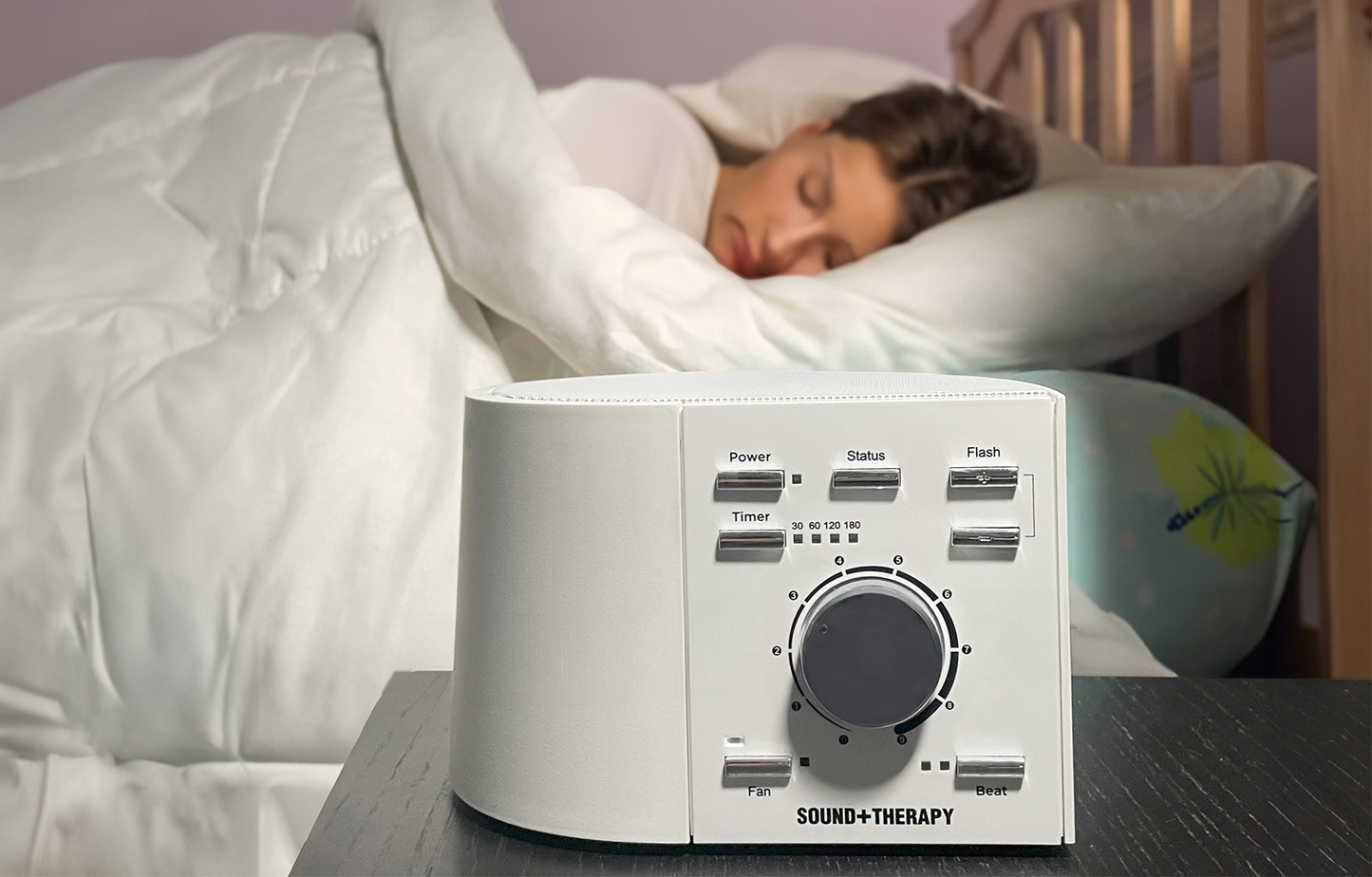 Woman Sleeping behind SOUND+THERAPY sleep system